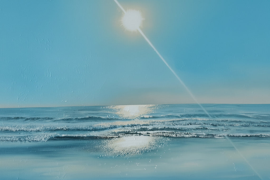Framed beach scene with ocean and sun on a wall