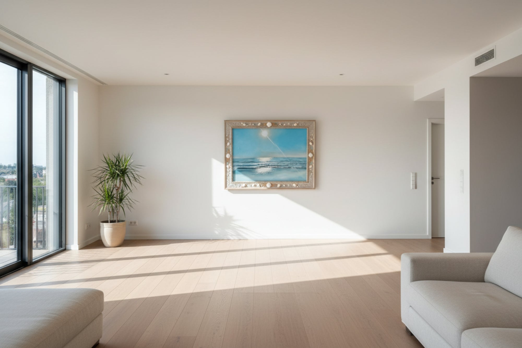 Framed artwork of a beach scene with a blue sky and ocean, decorated with shells and starfish.